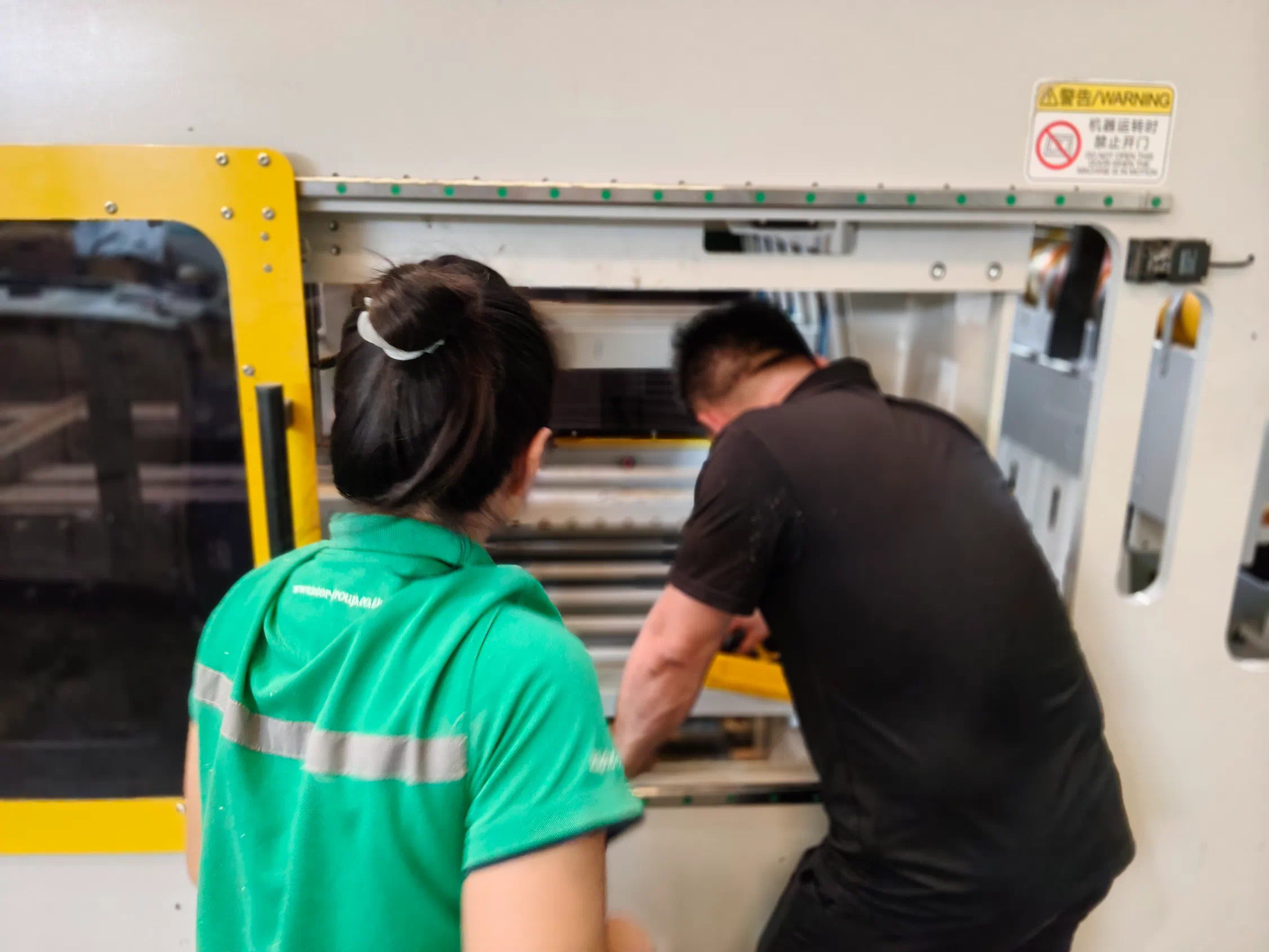 KUNSHAN INDEED after-sales team calibrating the folder gluer at Inter Fiber Container’s Thai factory